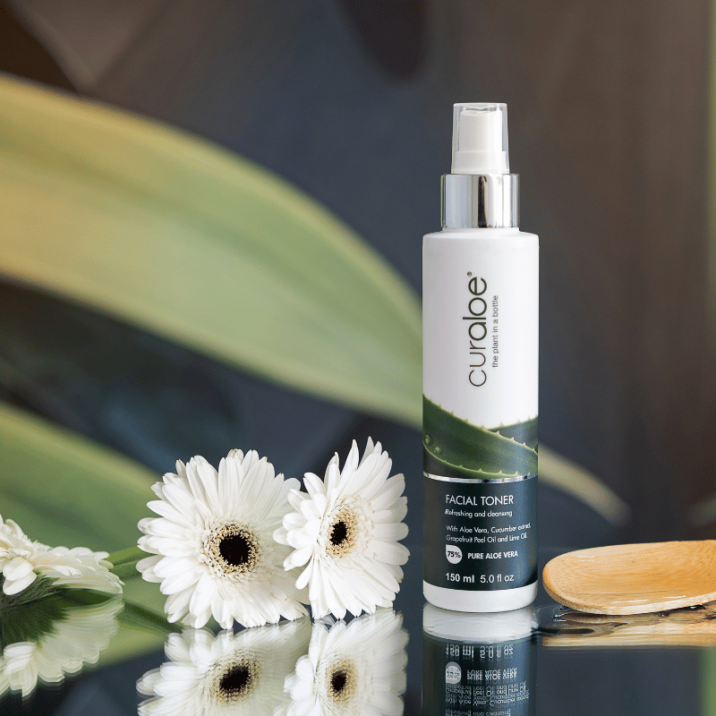 Curaloe toner infused with natural ingredients like witch hazel and cucumber extract, promoting skin healing and reduced puffiness